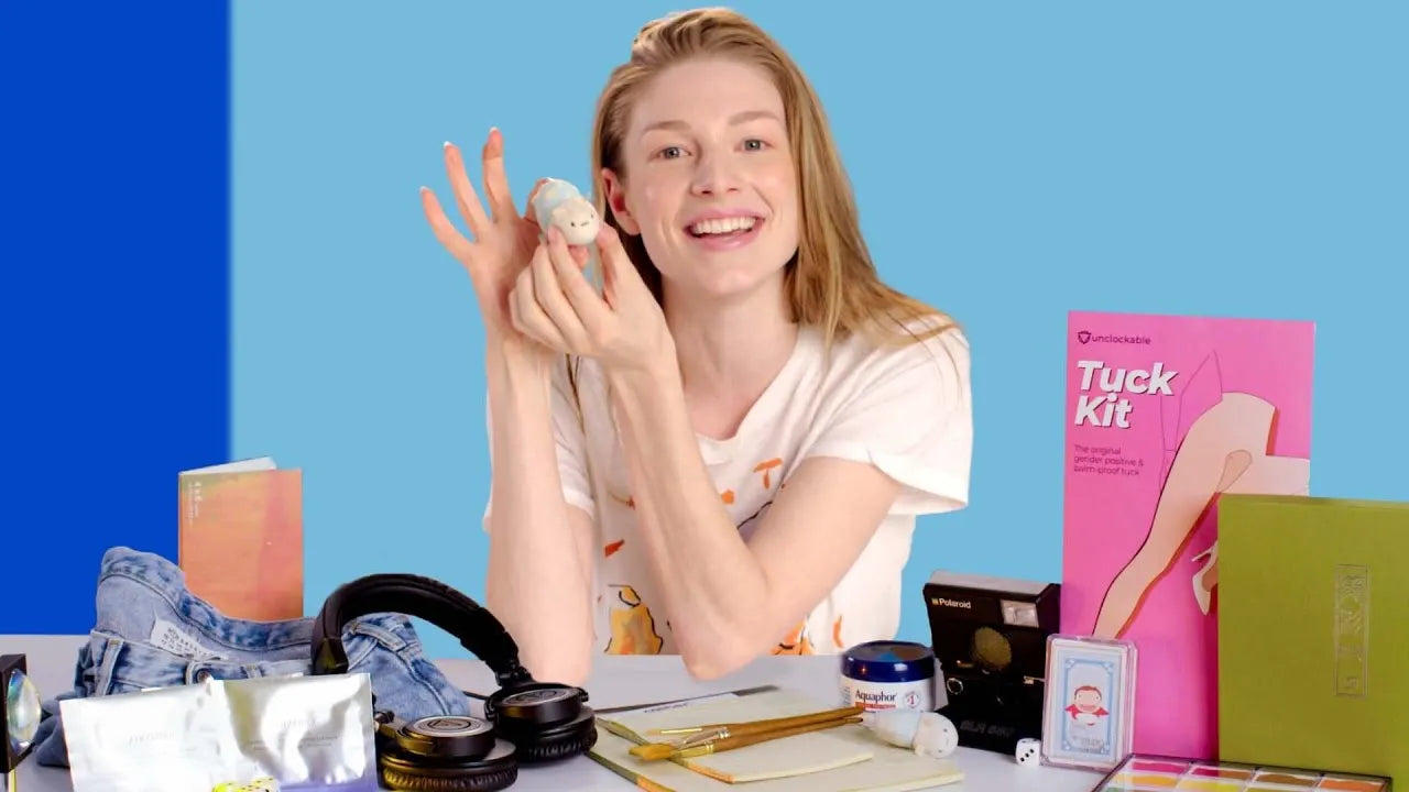 A small white ceramic figurine with a soft rounded body and delicate facial features featured in hunter schafer’s tuck kit must have