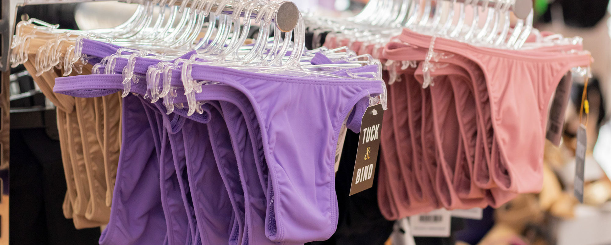 Photo of tucking gaffs on hangers in store