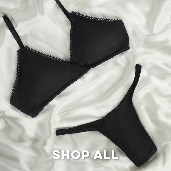 A bra and a gaff on a silk background