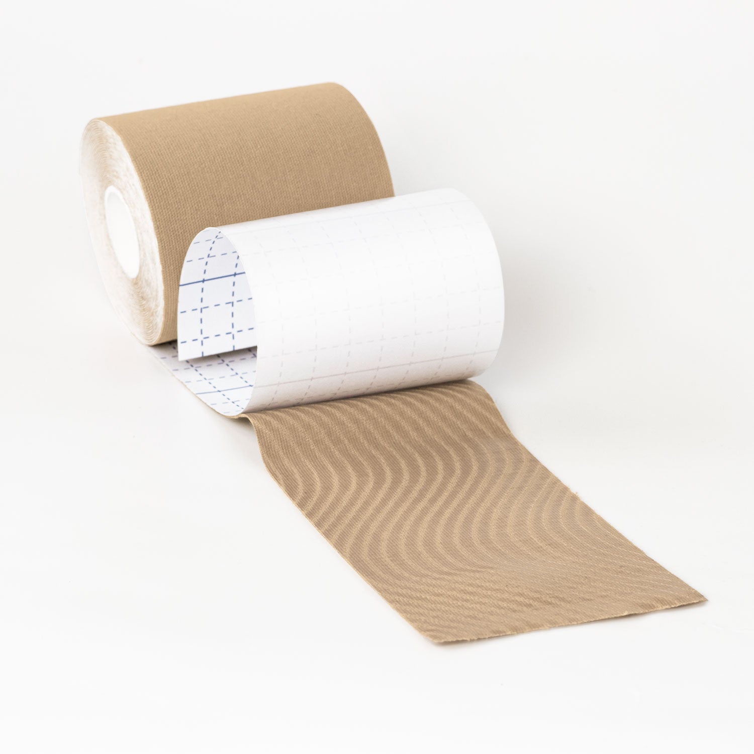 4-inch tan kinesiology binding tape roll with wavy textured adhesive backing