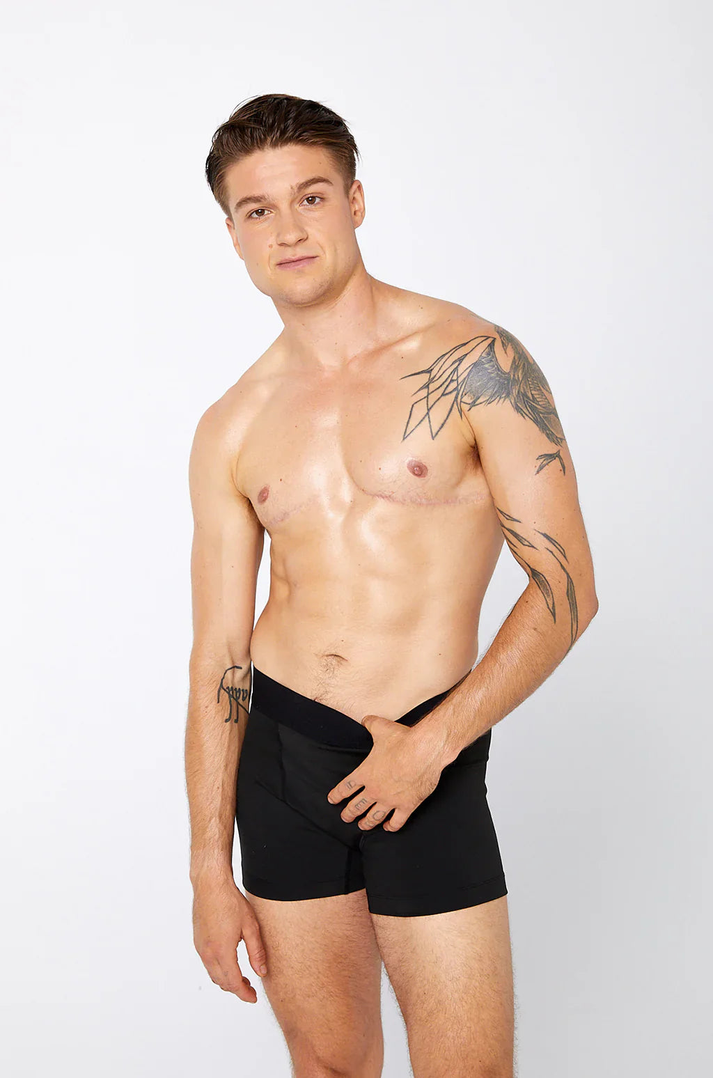 Black compression short athletic briefs in smooth form-fitting design