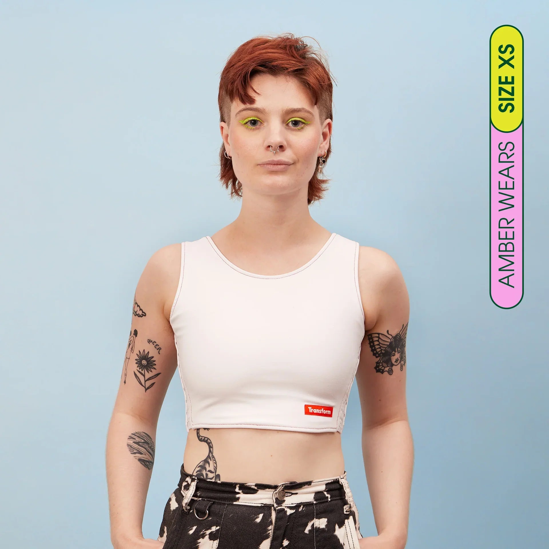 White cropped tank top chest binder with red transform logo on front