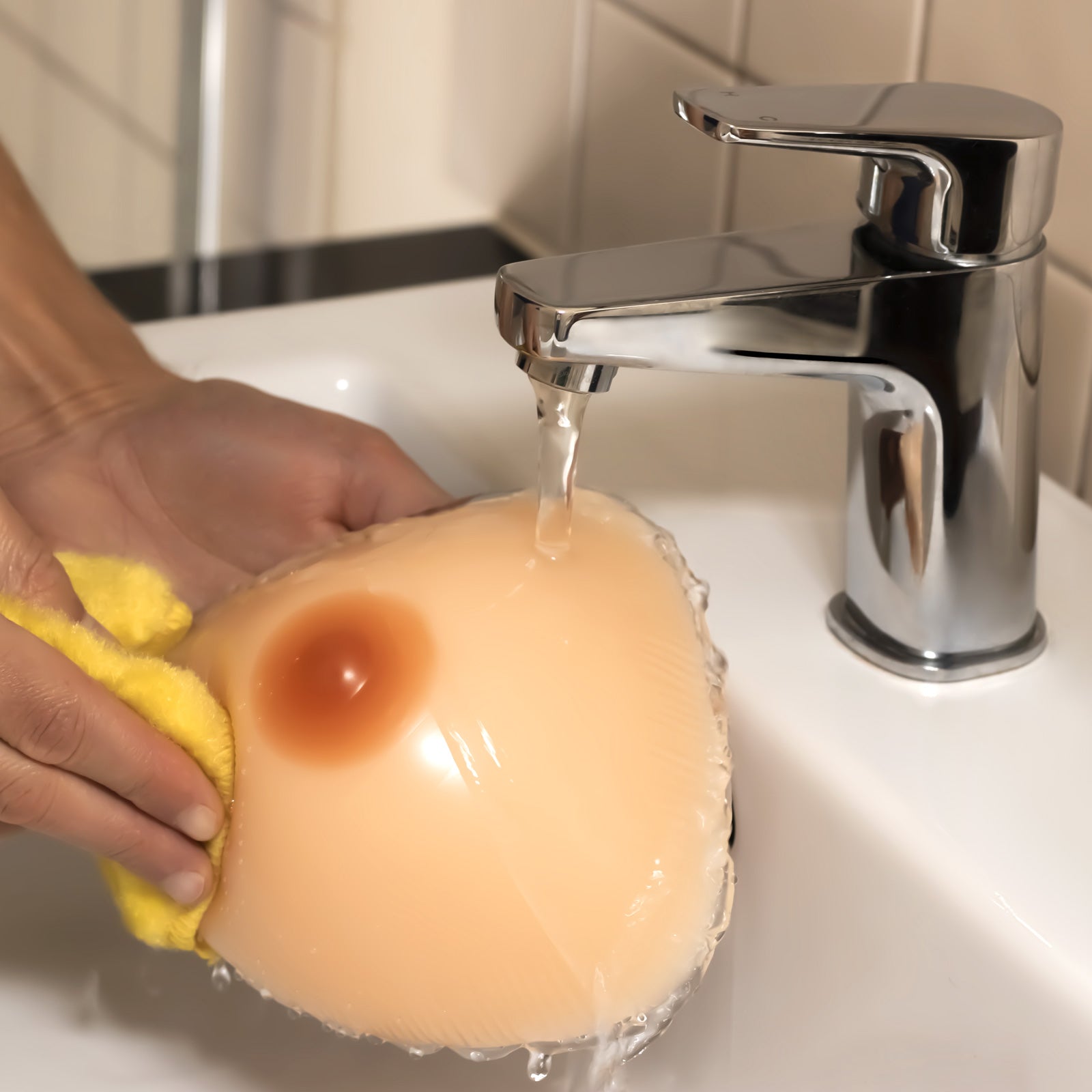 Washing breast form with water