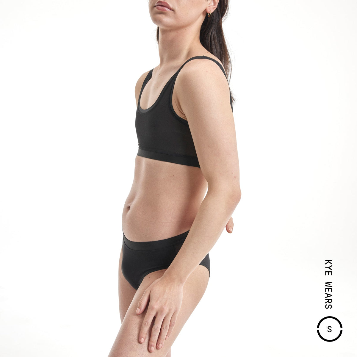 Black seamless minimalist sports bra with thin straps in Everybody Tuck Brief