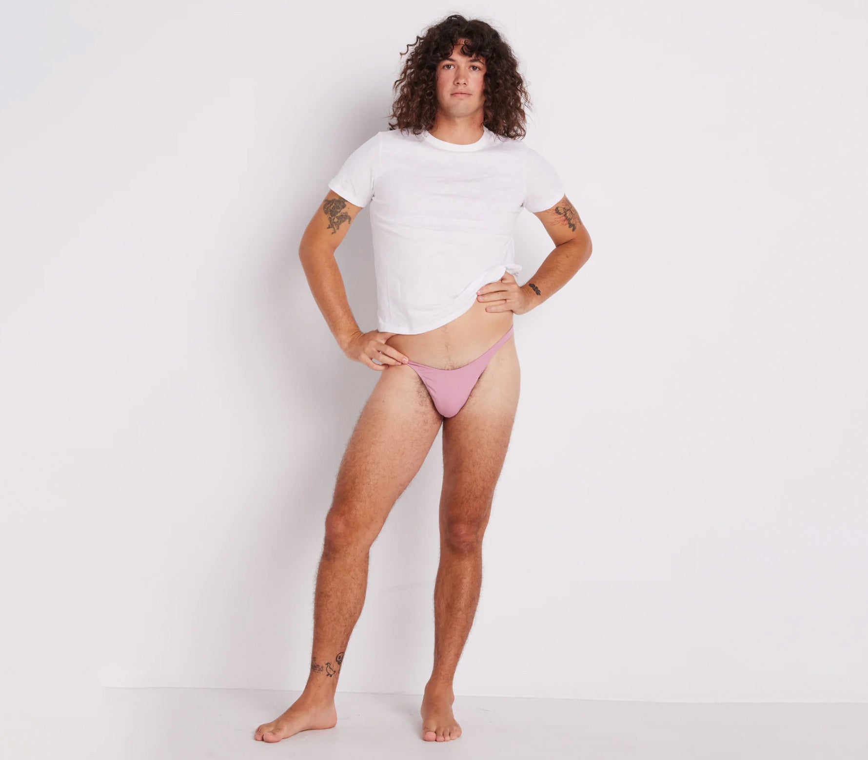 Full view of a person wearing a pink tucking gaff