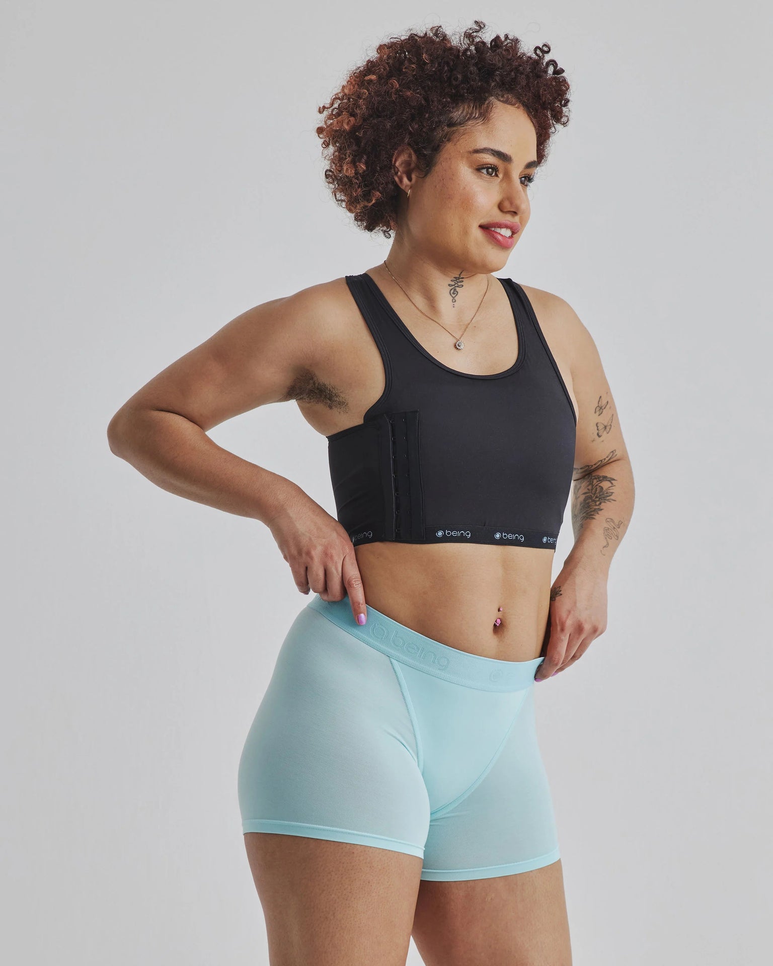 Black Being Wear Binder sports bra with side pockets and logo hem