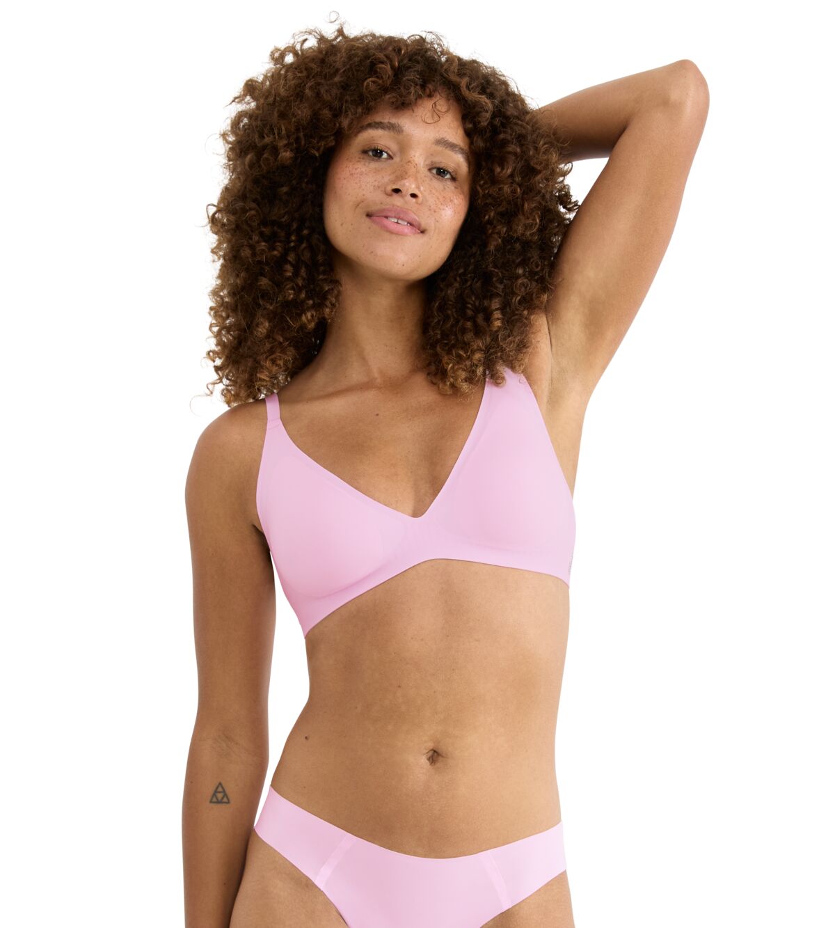 A soft pink seamless bra and matching briefs set in a minimalist design from the up bra collection